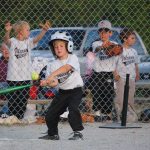 Small child playing baseball